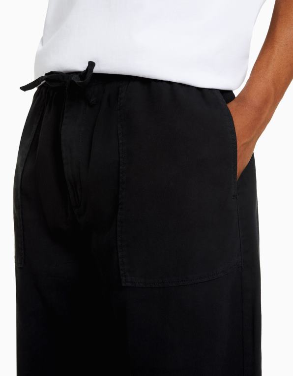 muži Bershka rustikální kalhoty volného střihu P88443214 oblečení Černá