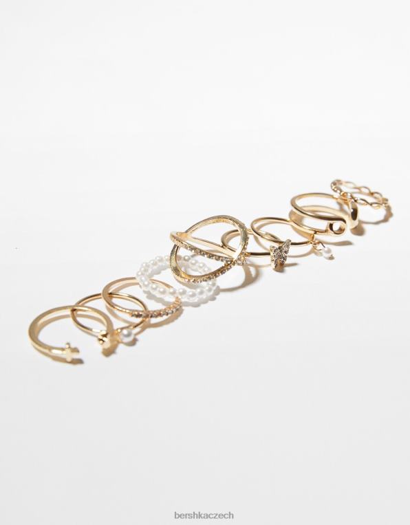 ženy Bershka sada 9 kroužků s motýlkem a křížem P88442475 Příslušenství zlato